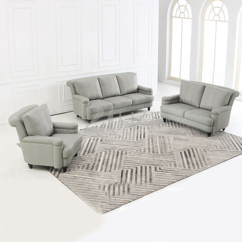 Divano da soggiorno in pelle con mobili contemporanei con pouf